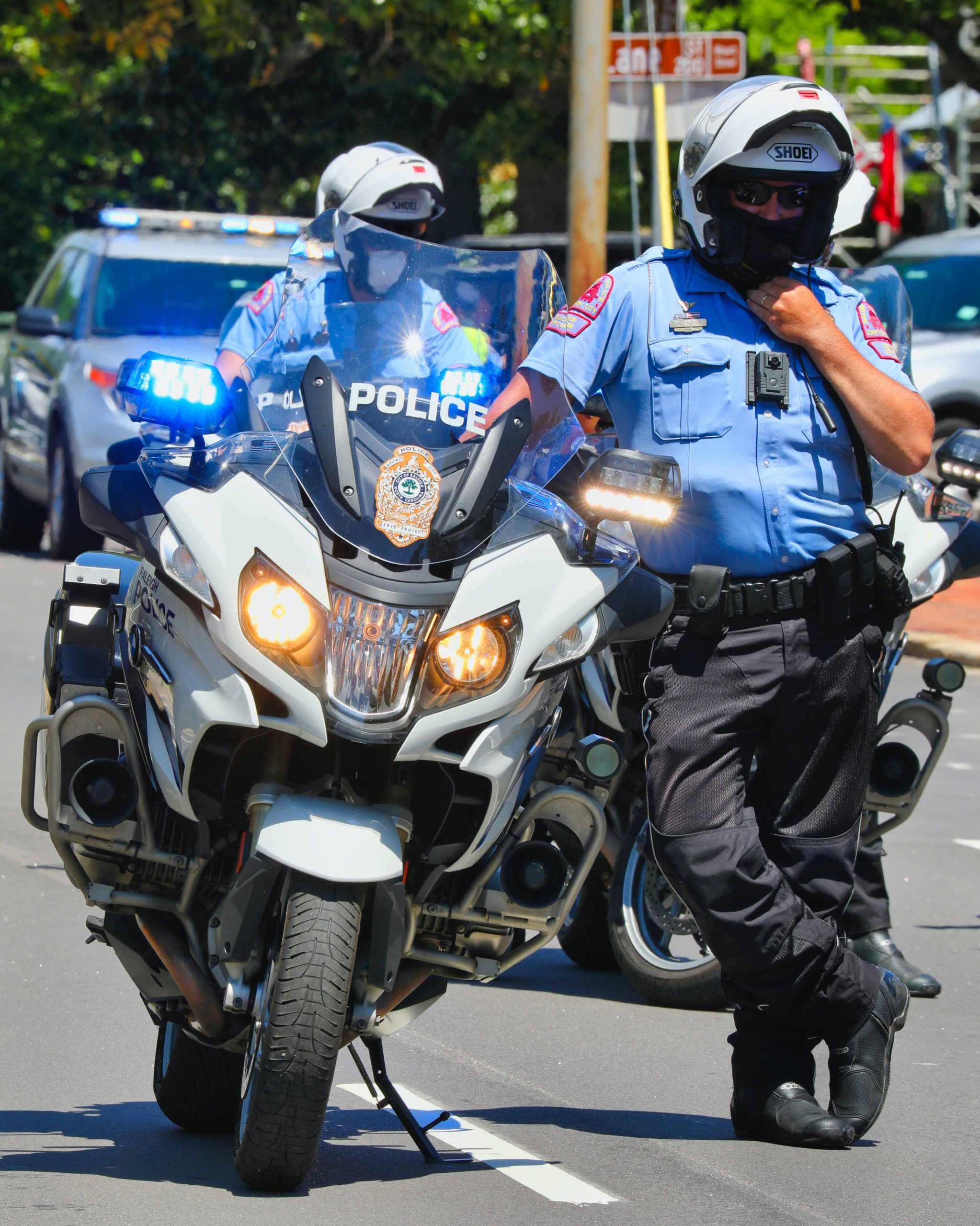 police officer next to motorcycle